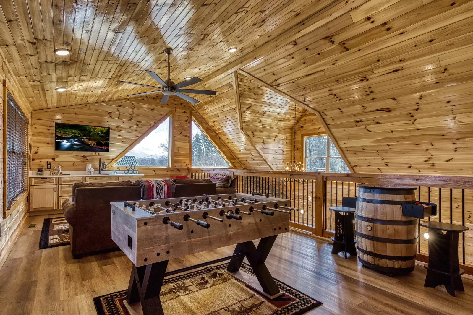 Cozy Cub Cabin upper level loft area with foosball table