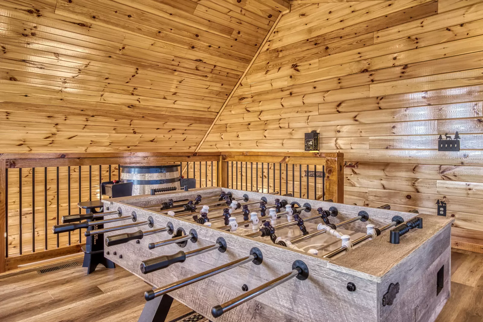 Cozy Cub Cabin upper level loft area with foosball table