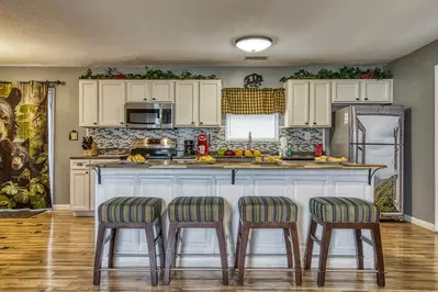 Four Bearoom Cottage kitchen island and bar stools 