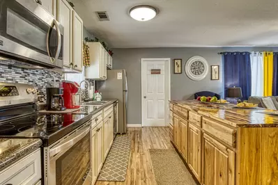 Four Bearoom Cottage kitchen island and fully furnished kitchen