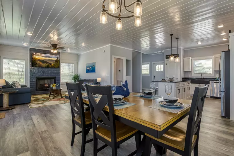 Lake View Therapy dining table, fully furnished kitchen, and living room