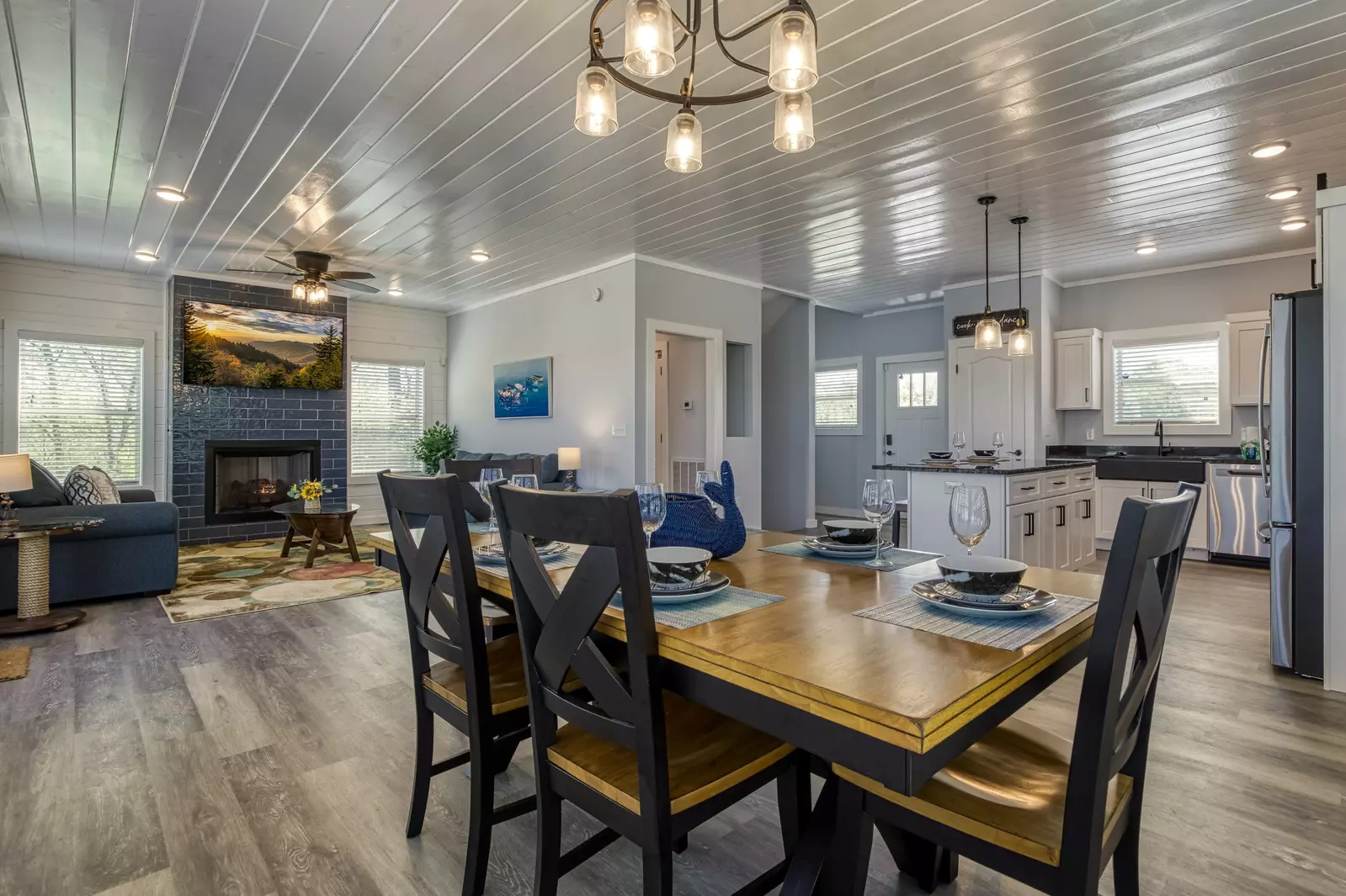 Lake View Therapy dining table, fully furnished kitchen, and living room