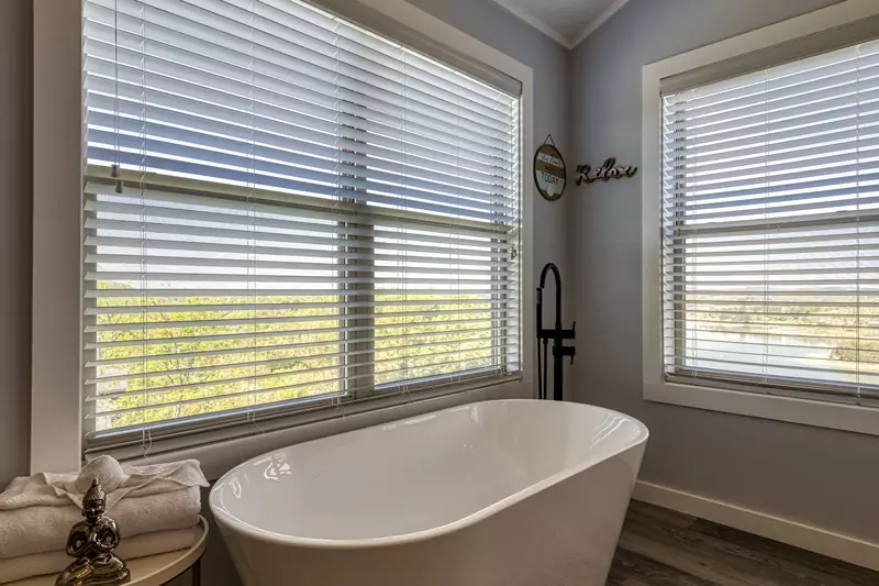 Lake View Therapy upper level bedroom with spa soaking tub