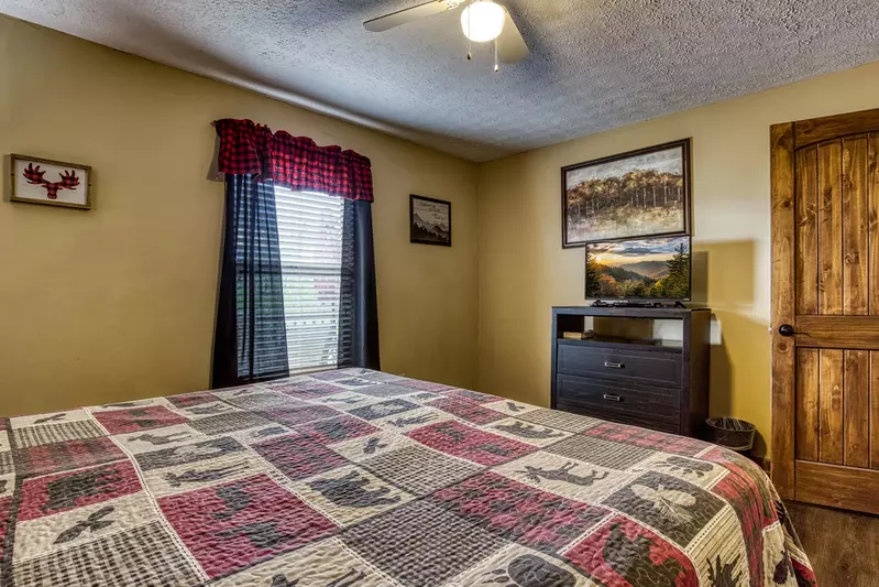 Moose Haven Cabin bedroom one with a king size bed