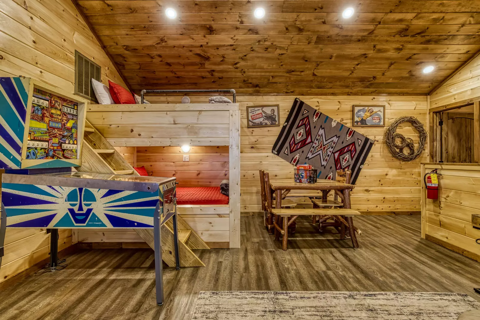 Mountown Moments Vista upper level game room with pin ball machine and queen over queen bunk beds