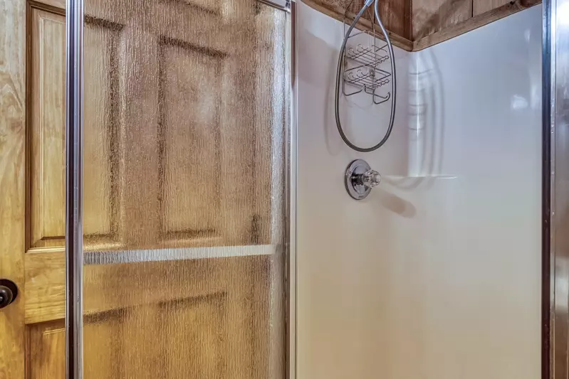 Old Glory loft area bathroom with walk in shower