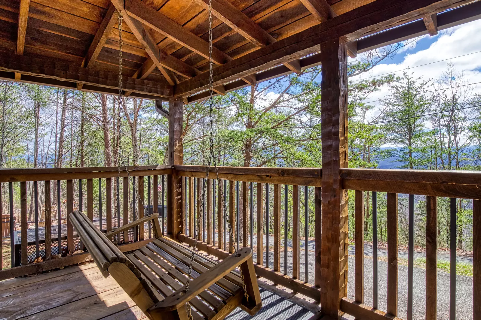 Old Glory covered front deck with swing