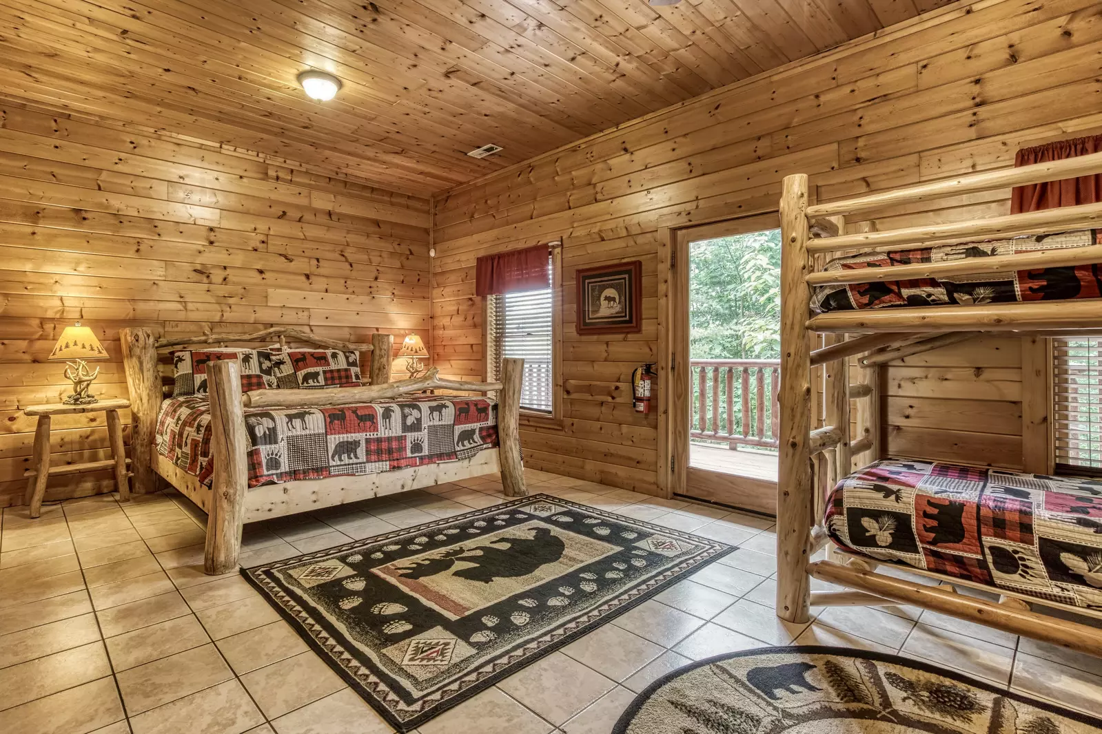 Rainbows End lower level open area with king size bed and bunk beds
