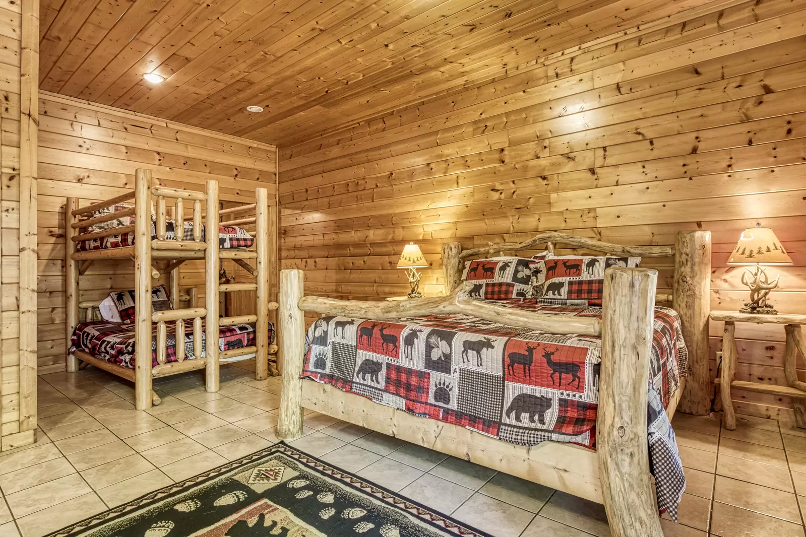Rainbows End lower level open area with king size bed and bunk beds