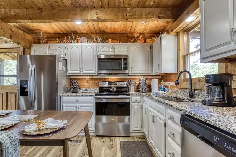 Secluded Summit fully furnished kitchen with granite countertops