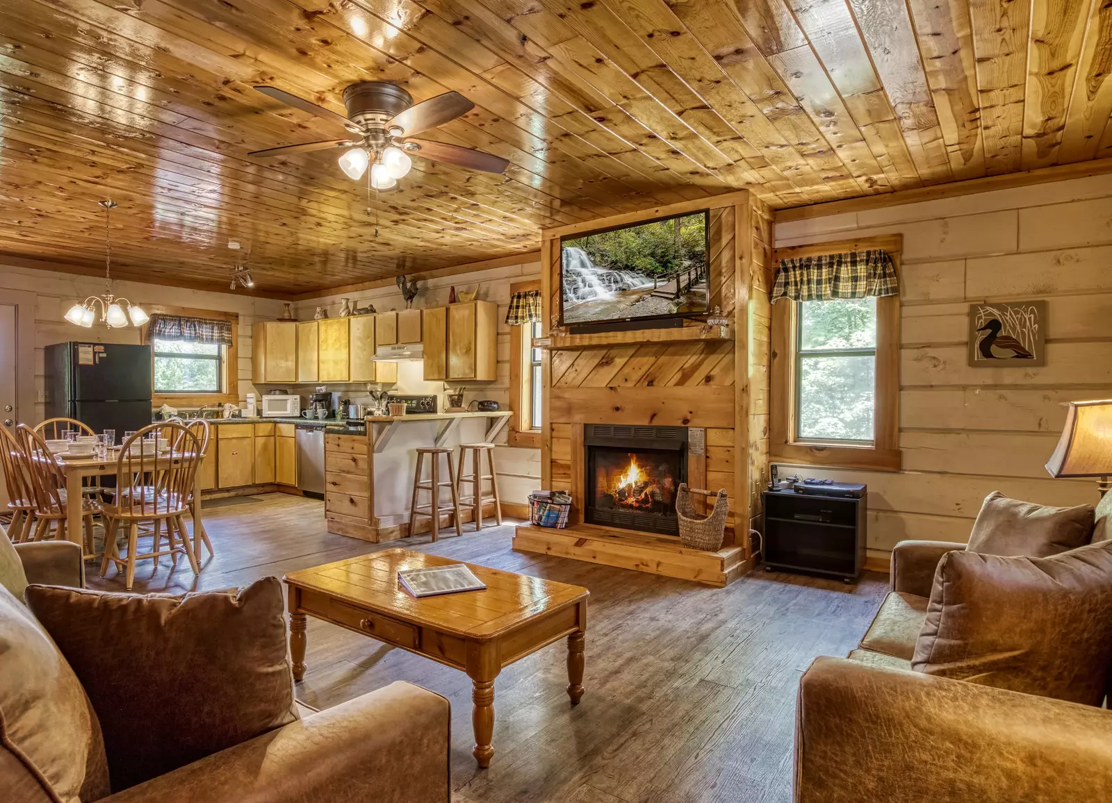 Serenity Ridge - Living room with wood encased gas fireplace
