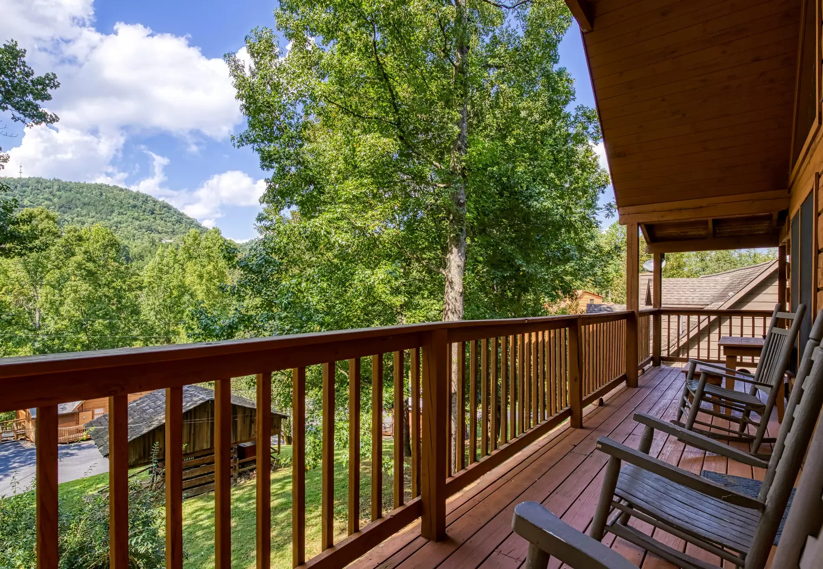 Squirrels Nest covered back deck with rocking chairs