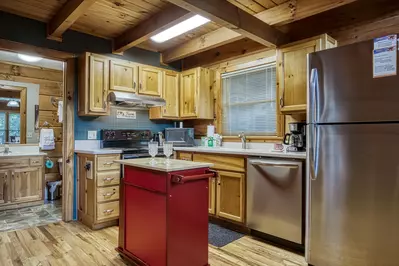 Squirrels Nest fully furnished kitchen with stainless steel appliances
