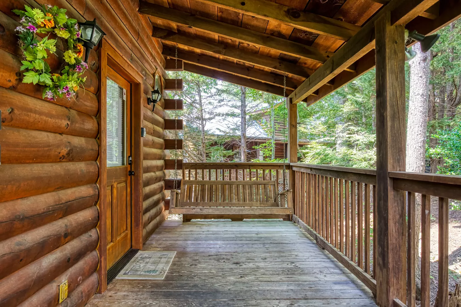 Tennessee Twilight Cabin covered entry deck with swing