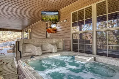 The Road Less Traveled covered back deck with hot tub and TV