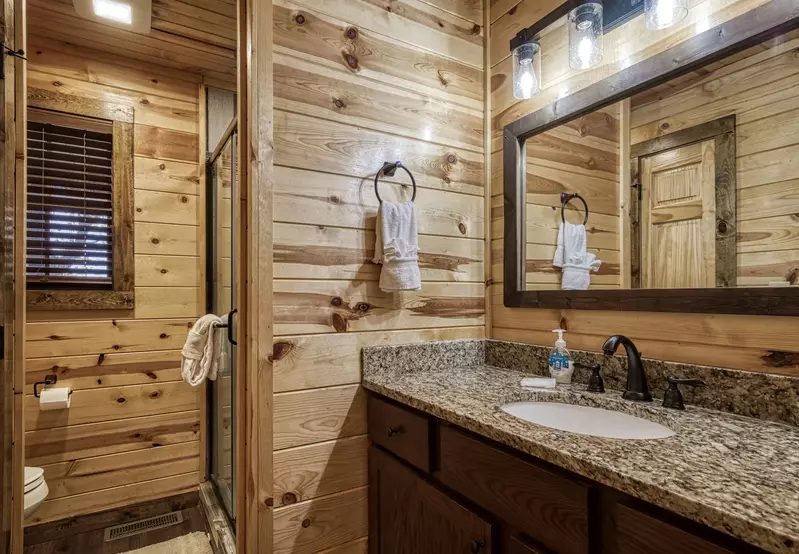The Road Less Traveled bathroom with granite countertops