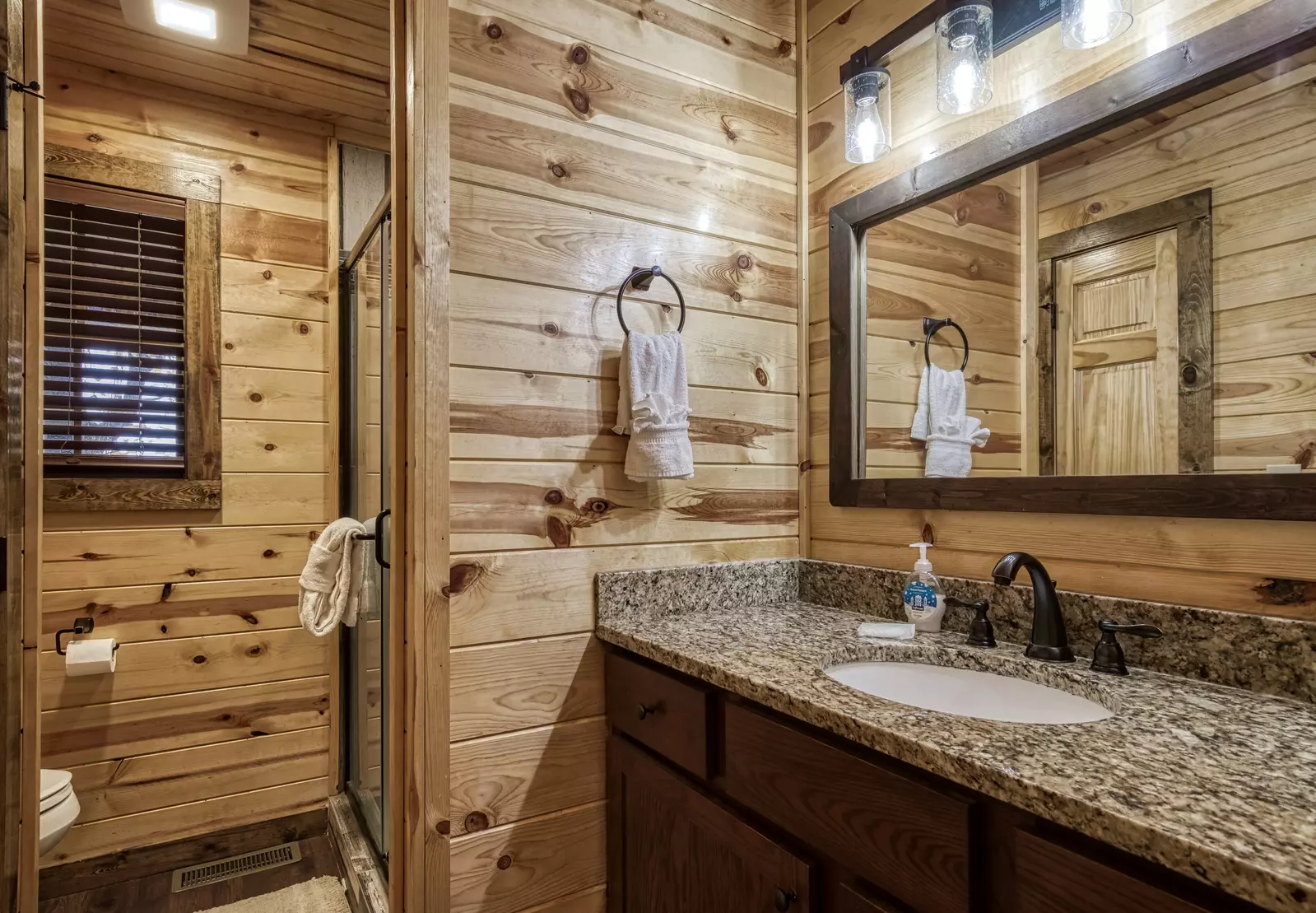 The Road Less Traveled bathroom with granite countertops