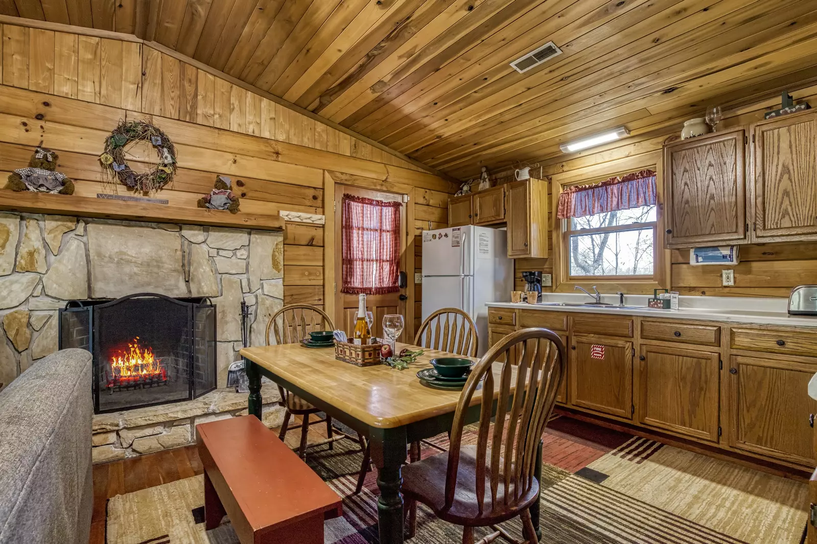 Walden Ridge Retreat dining table and wood burning fireplace