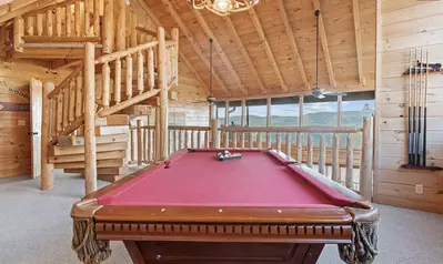 Enjoy a game of pool with a sweeping view of the Smoky Mountains