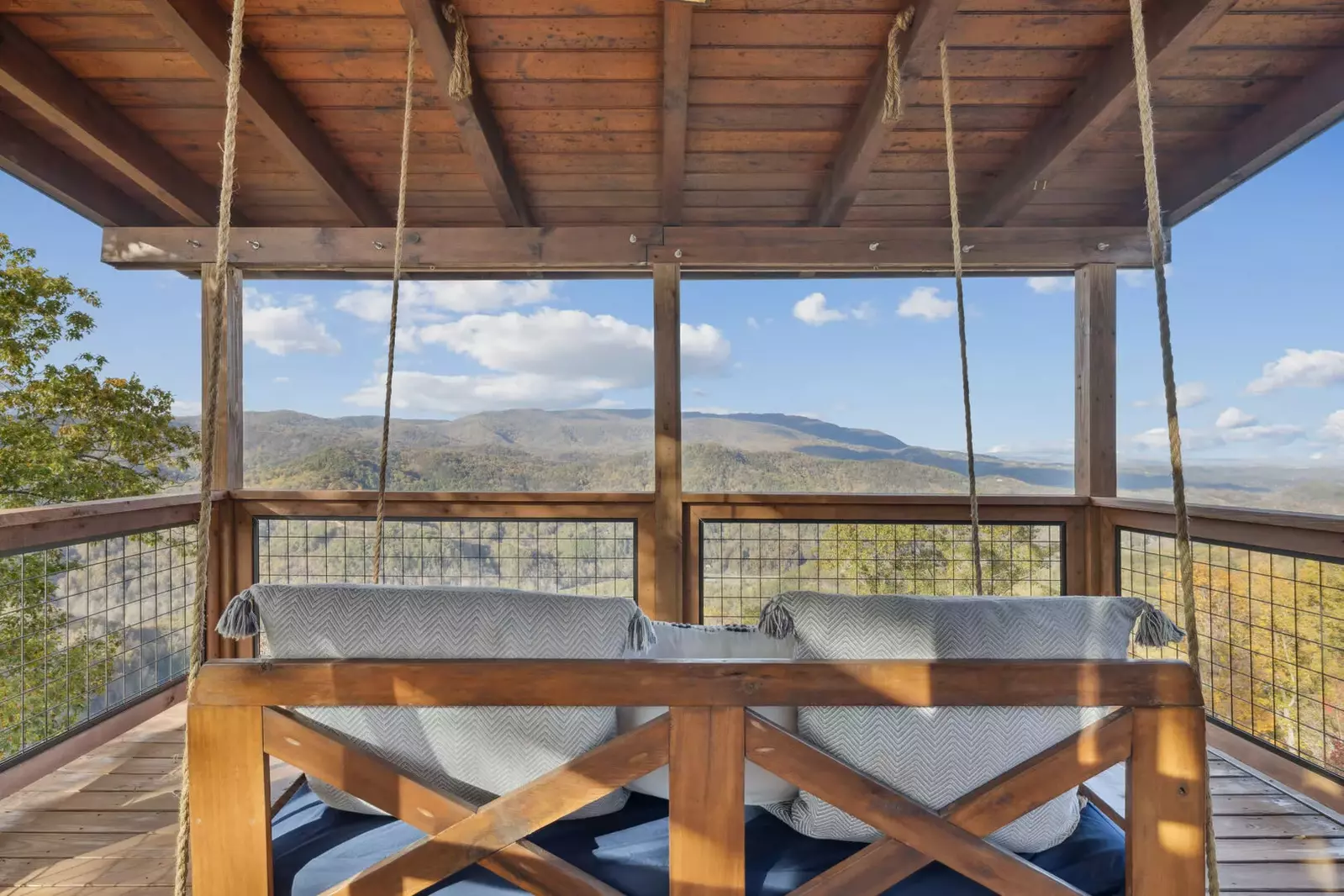 Relax on the day bed swing to take in the mountain views from the 3rd floor private balcony