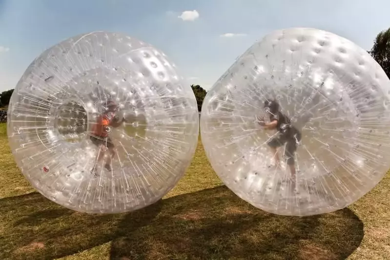 Two kids enjoying Zorb Smoky Mountains at the Outdoor Gravity Park Pigeon Forge.
