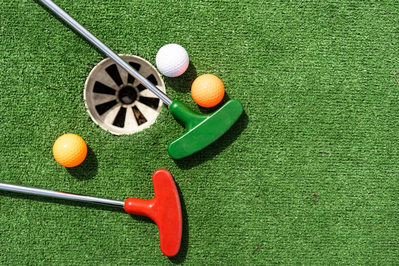 mini golf balls and clubs