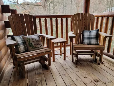 Gliders on the main deck are perfect for taking in the beauty of the woods