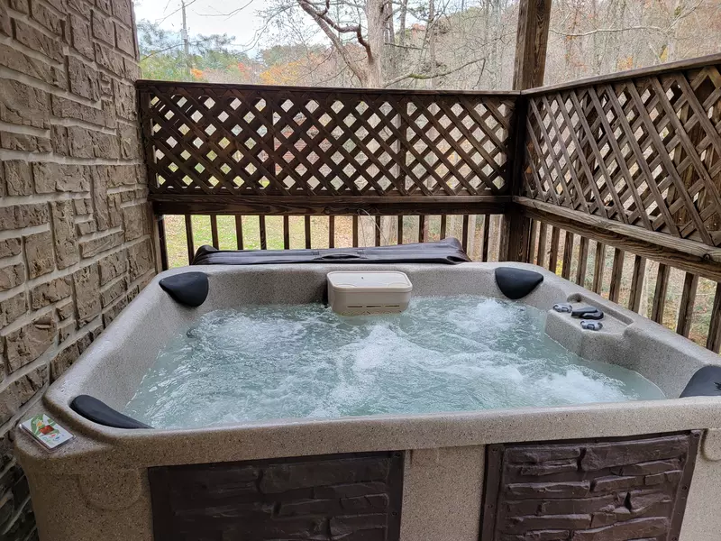 Relax in the bubbling hot tub on the lower deck