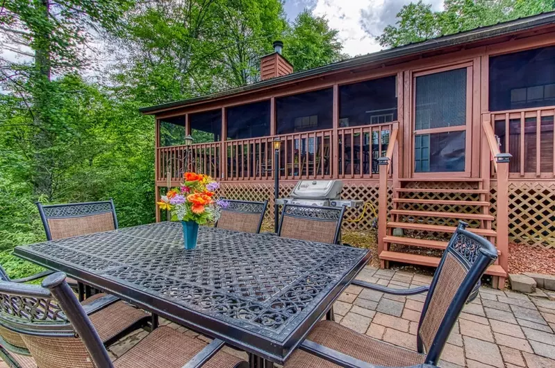 Beautiful outdoor paver patio with firepit. Firewood provided