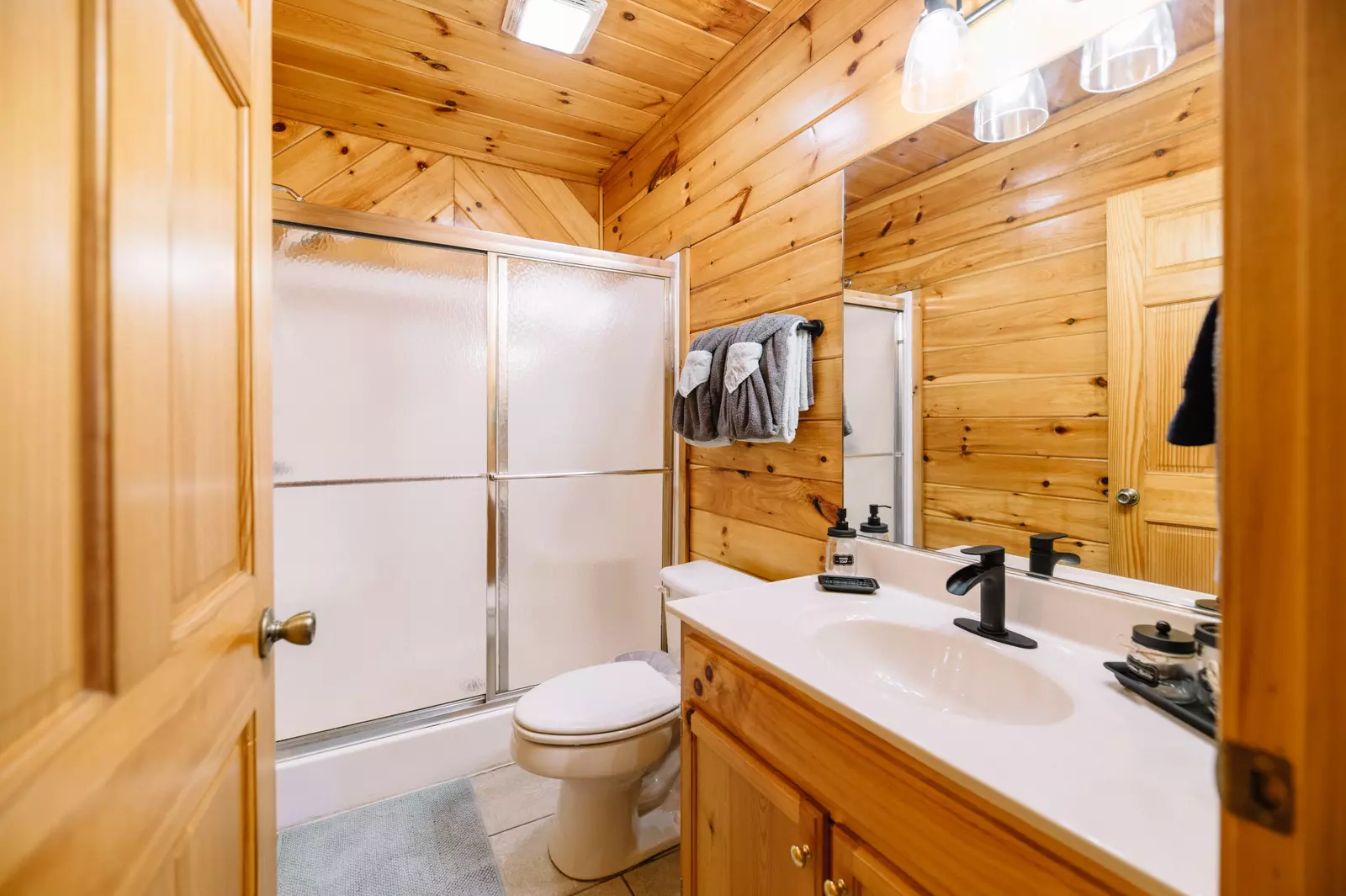 Two additional bathrooms are located on the first and second floors.