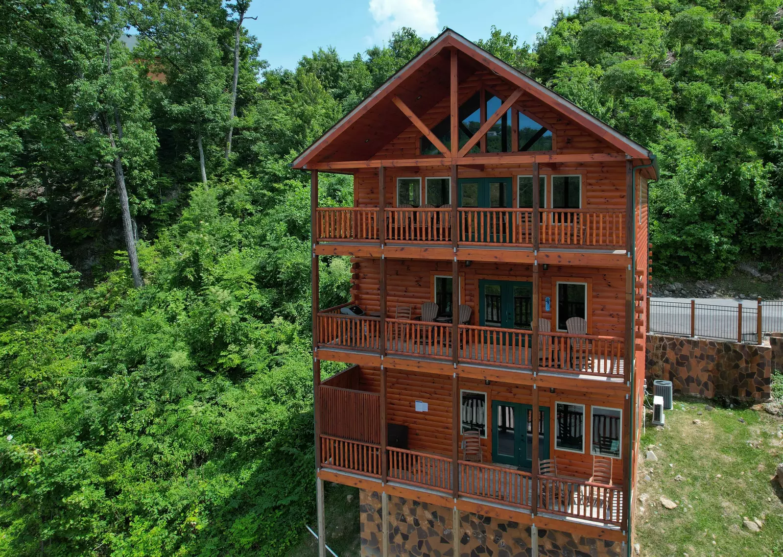 This log cabin is nestled up to nature and offers more solitude as an end unit