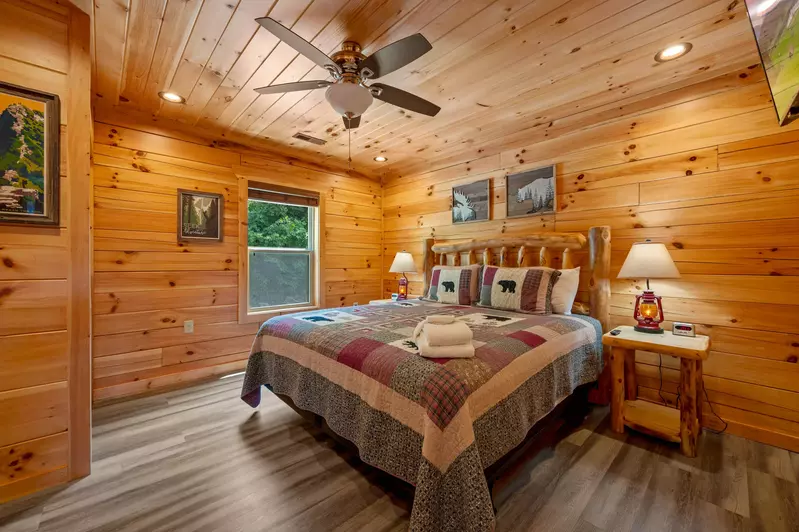 Main level master bed has 55" Roku TV, ironing board, iron, bathroom & vacuum