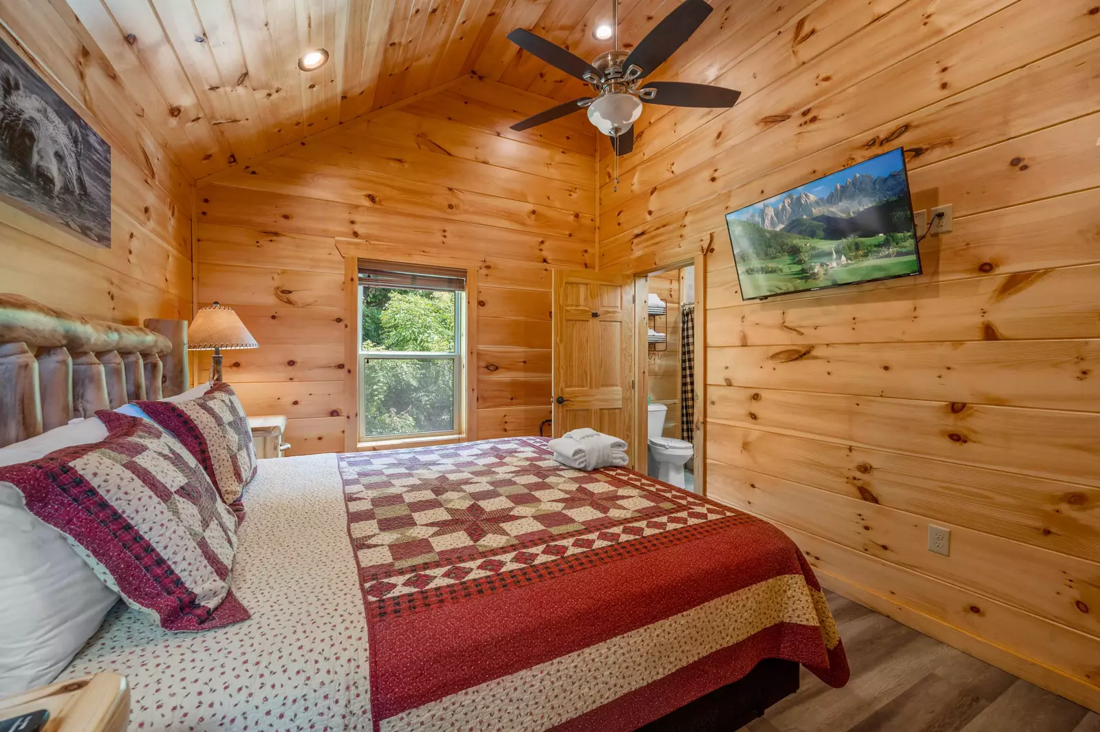 Upstairs master bedroom with king bed, private bathroom and 43" Roku TV