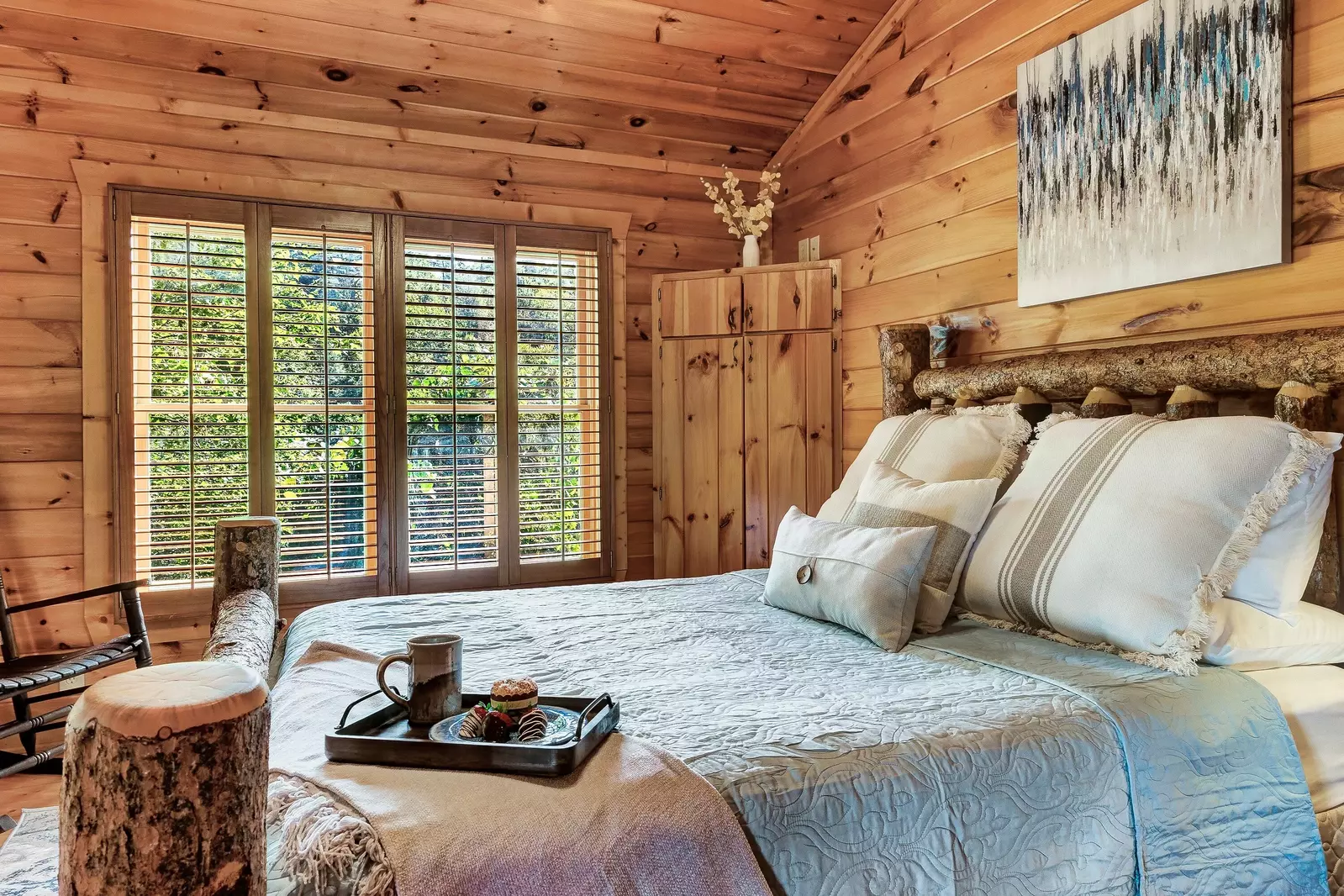 Beautiful log queen bed upstairs for peace and privacy.
