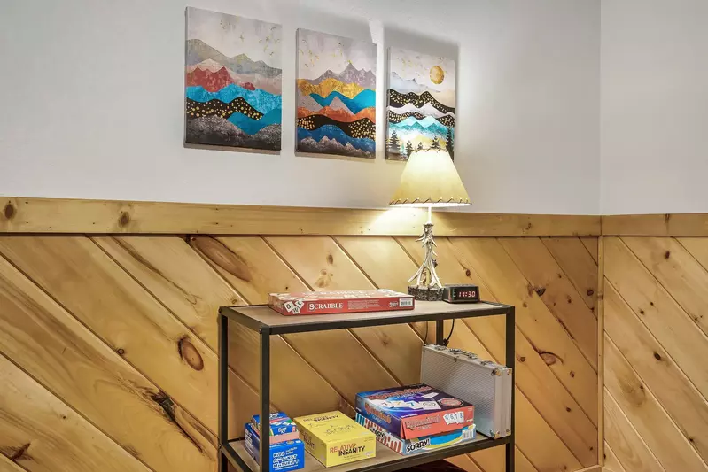 Board games and board books in the bunk room.