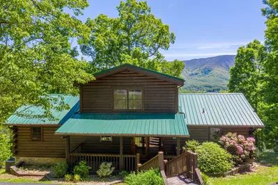 A spacious 2,500 square foot luxury log cabin on a large lot with mountain views.