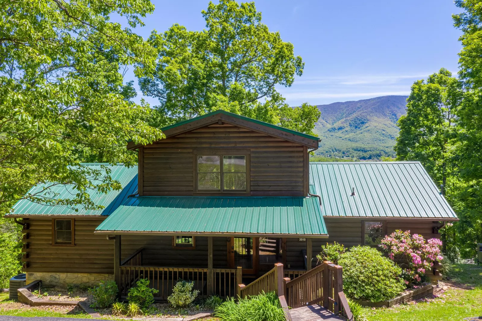 A spacious 2,500 square foot luxury log cabin on a large lot with mountain views.
