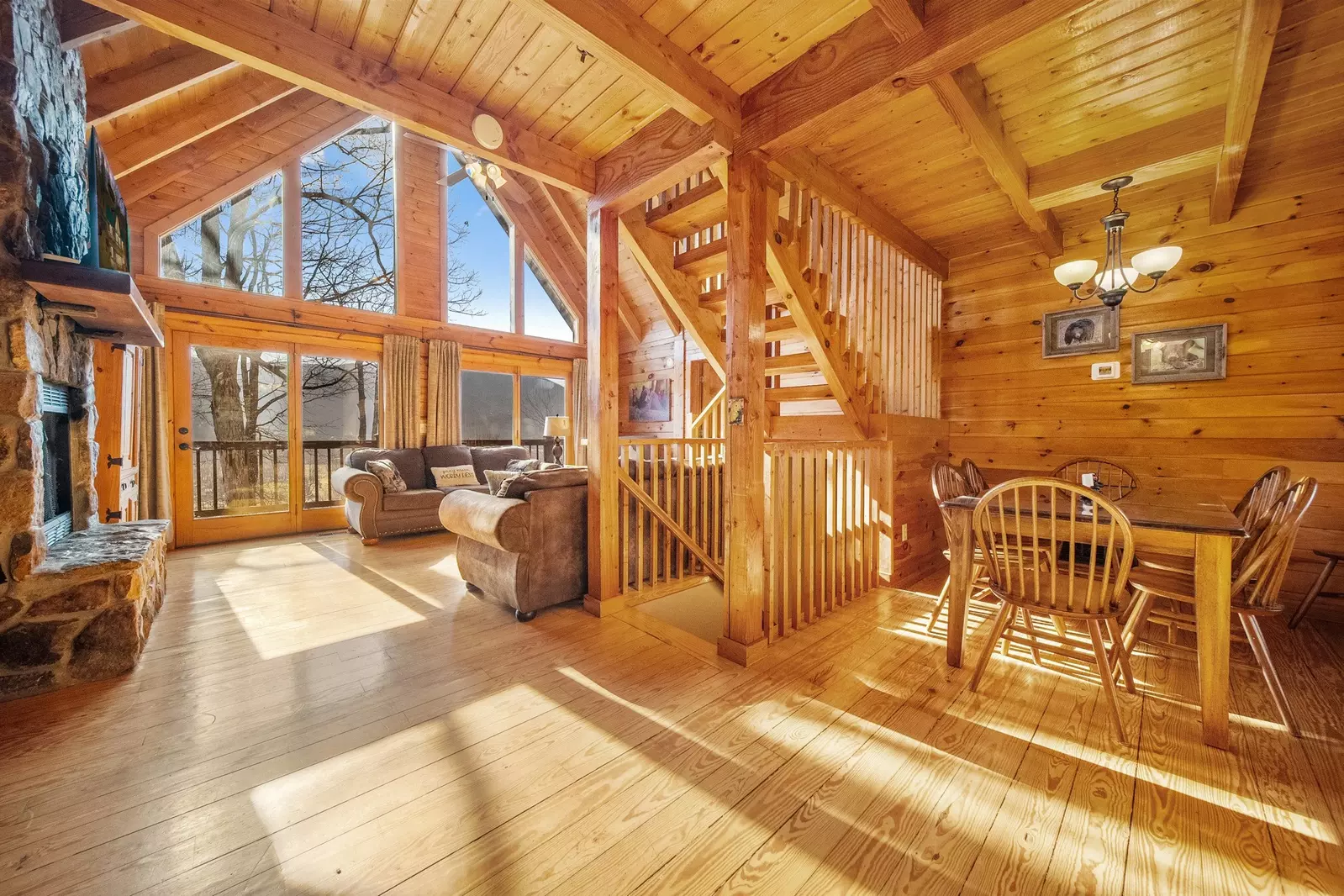 Open floor plan with real wood floors and big beams.