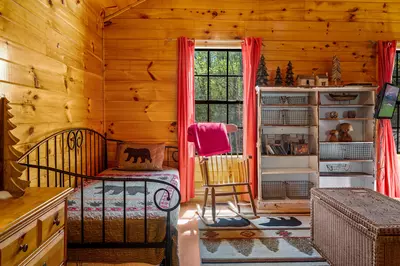 Permanent Vacation, a cozy 1-bedroom cabin tucked in the woods of Sevierville. Guests love its quiet, private setting—perfect for honeymoons, anniversaries, or small family getaways. Just 8 miles from the Parkway in Pigeon Forge, you’ll enjoy the best of both worlds: peaceful seclusion and easy access to the Smoky Mountains’ best attractions.