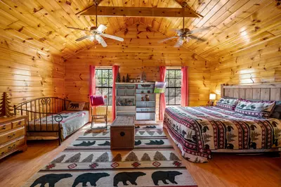 Permanent Vacation, a cozy 1-bedroom cabin tucked in the woods of Sevierville. Guests love its quiet, private setting—perfect for honeymoons, anniversaries, or small family getaways. Just 8 miles from the Parkway in Pigeon Forge, you’ll enjoy the best of both worlds: peaceful seclusion and easy access to the Smoky Mountains’ best attractions.