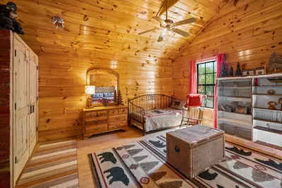 Permanent Vacation, a cozy 1-bedroom cabin tucked in the woods of Sevierville. Guests love its quiet, private setting—perfect for honeymoons, anniversaries, or small family getaways. Just 8 miles from the Parkway in Pigeon Forge, you’ll enjoy the best of both worlds: peaceful seclusion and easy access to the Smoky Mountains’ best attractions.