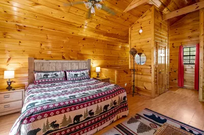 Permanent Vacation, a cozy 1-bedroom cabin tucked in the woods of Sevierville. Guests love its quiet, private setting—perfect for honeymoons, anniversaries, or small family getaways. Just 8 miles from the Parkway in Pigeon Forge, you’ll enjoy the best of both worlds: peaceful seclusion and easy access to the Smoky Mountains’ best attractions.