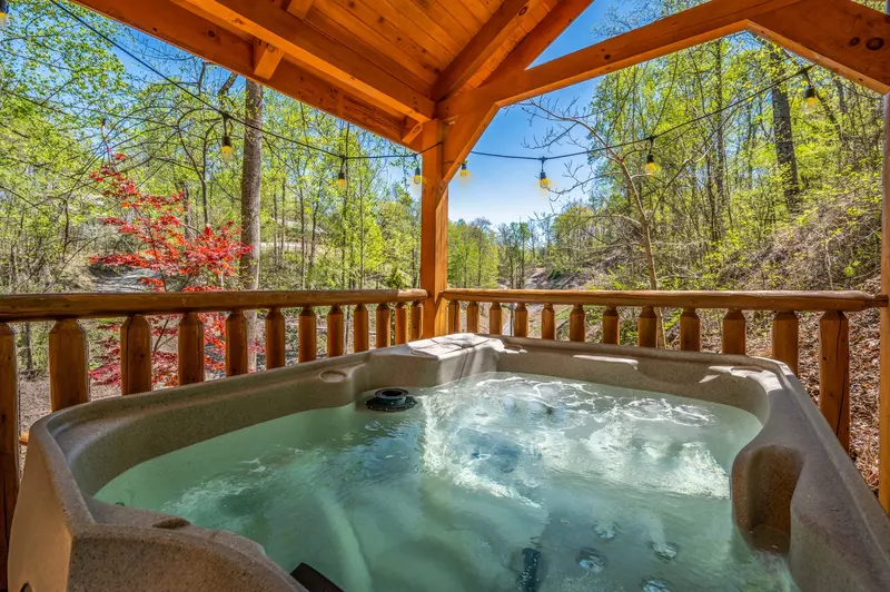 Permanent Vacation, a cozy 1-bedroom cabin tucked in the woods of Sevierville. Guests love its quiet, private setting—perfect for honeymoons, anniversaries, or small family getaways. Just 8 miles from the Parkway in Pigeon Forge, you’ll enjoy the best of both worlds: peaceful seclusion and easy access to the Smoky Mountains’ best attractions.