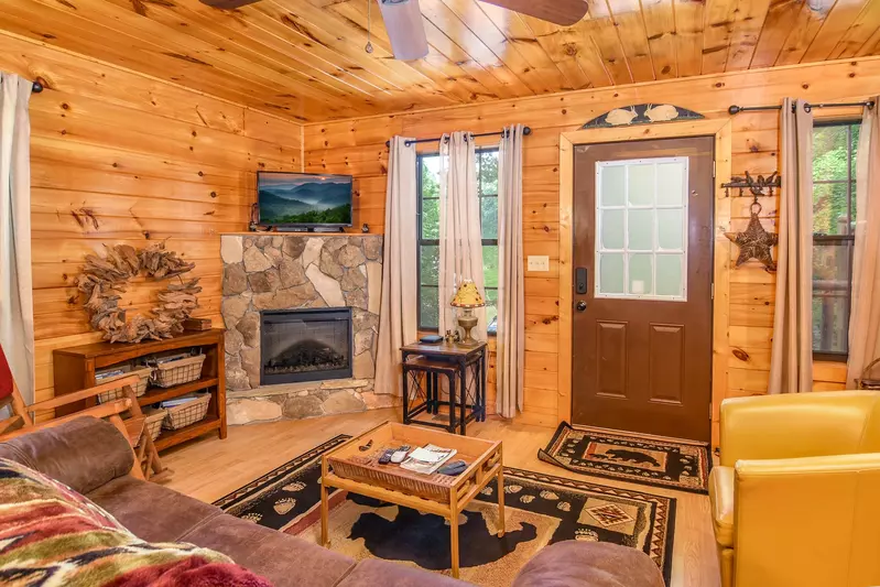 Permanent Vacation, a cozy 1-bedroom cabin tucked in the woods of Sevierville. Guests love its quiet, private setting—perfect for honeymoons, anniversaries, or small family getaways. Just 8 miles from the Parkway in Pigeon Forge, you’ll enjoy the best of both worlds: peaceful seclusion and easy access to the Smoky Mountains’ best attractions.