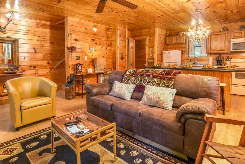 Permanent Vacation, a cozy 1-bedroom cabin tucked in the woods of Sevierville. Guests love its quiet, private setting—perfect for honeymoons, anniversaries, or small family getaways. Just 8 miles from the Parkway in Pigeon Forge, you’ll enjoy the best of both worlds: peaceful seclusion and easy access to the Smoky Mountains’ best attractions.