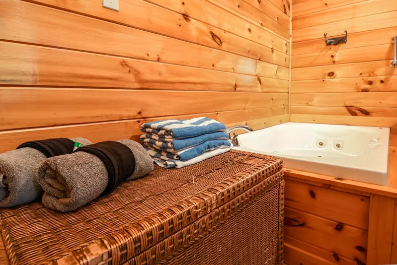 Permanent Vacation, a cozy 1-bedroom cabin tucked in the woods of Sevierville. Guests love its quiet, private setting—perfect for honeymoons, anniversaries, or small family getaways. Just 8 miles from the Parkway in Pigeon Forge, you’ll enjoy the best of both worlds: peaceful seclusion and easy access to the Smoky Mountains’ best attractions.