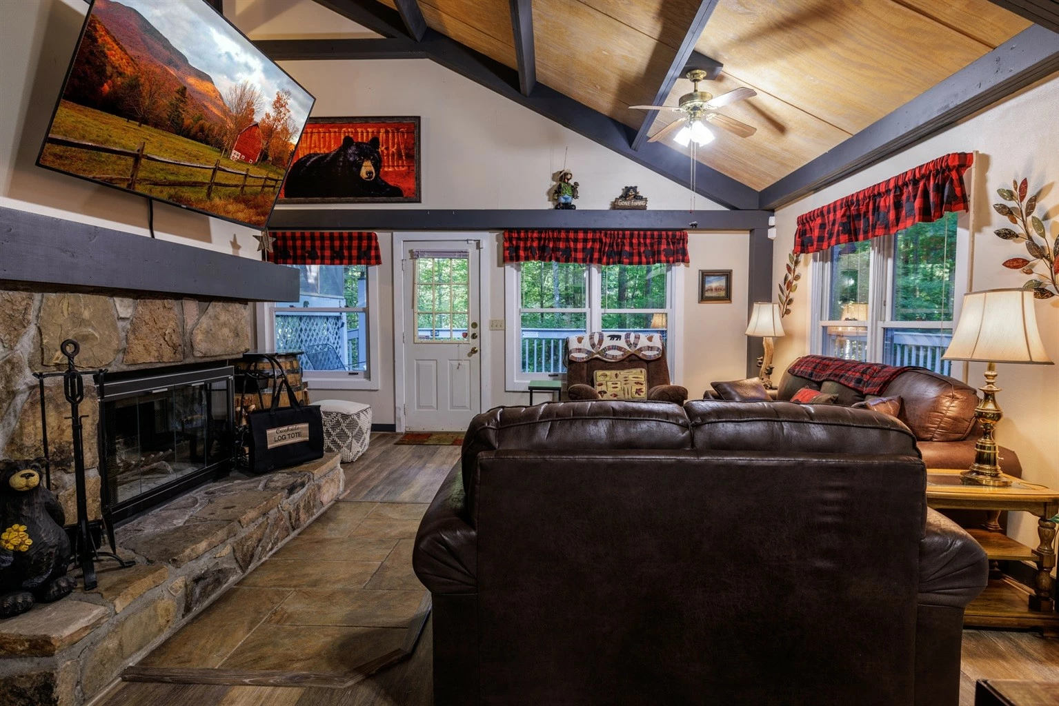 Misty Mountain Hop – a 2-bedroom, 2-bath Smoky Mountain cabin in Cobbly Nob Resort with screened-in hot tub, wrap-around decks, wood-burning fireplace, and access to pools, pickleball, and golf.