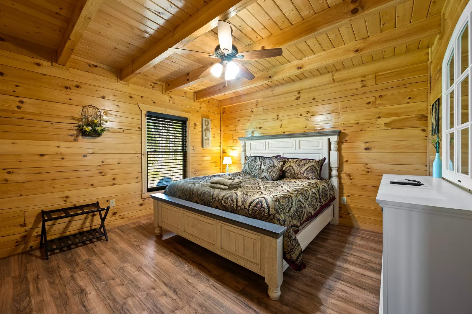 Nothin’ But a Good Time – a spacious 4-bedroom Smoky Mountain cabin rental in Sevierville featuring king bedrooms, twin bunks, hot tub, theater room, fire pit, and cozy mountain views.
