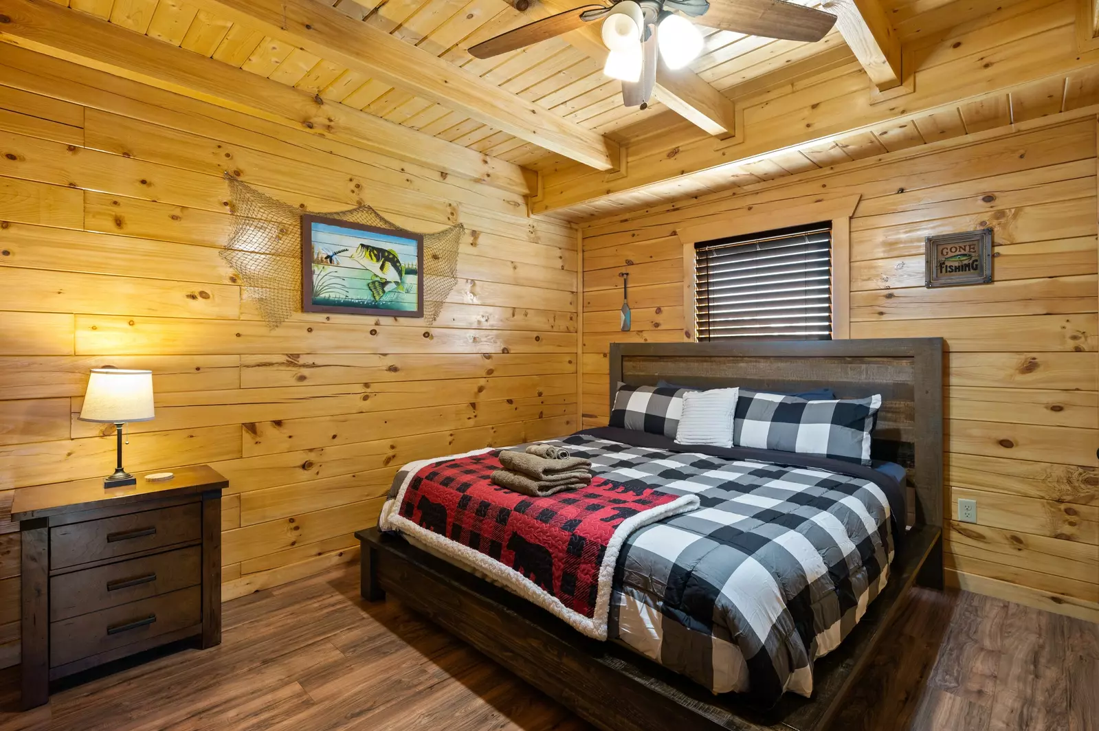 Nothin’ But a Good Time – a spacious 4-bedroom Smoky Mountain cabin rental in Sevierville featuring king bedrooms, twin bunks, hot tub, theater room, fire pit, and cozy mountain views.