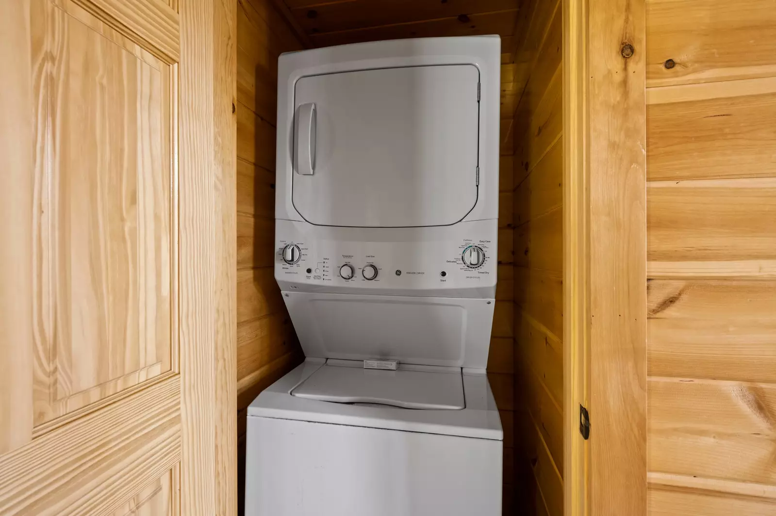 Nothin’ But a Good Time – a spacious 4-bedroom Smoky Mountain cabin rental in Sevierville featuring king bedrooms, twin bunks, hot tub, theater room, fire pit, and cozy mountain views.